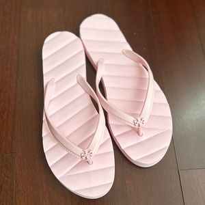 Tory Burch Kira flip flop in Petunia. NEVER WORN!